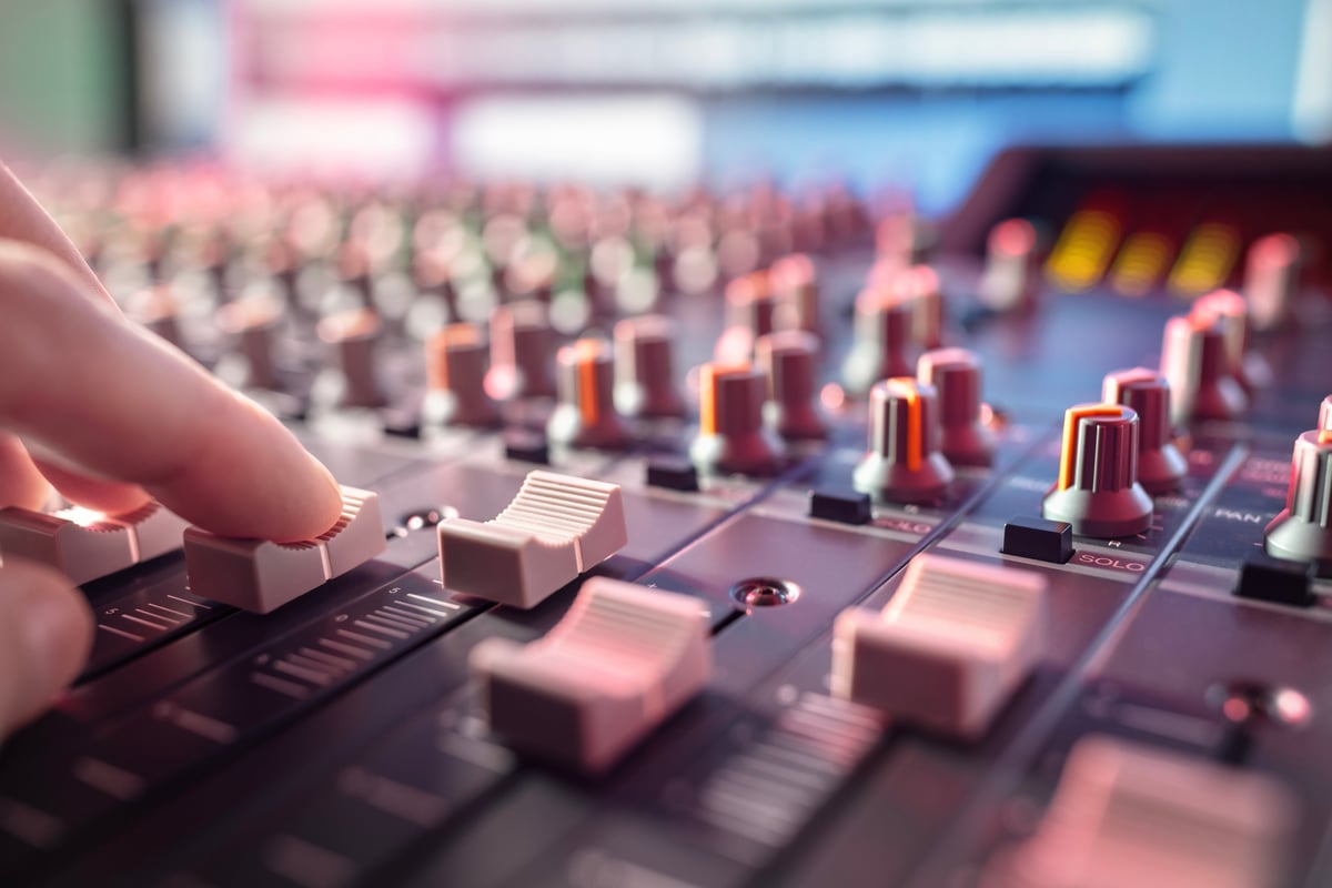 Music producer at mixing desk